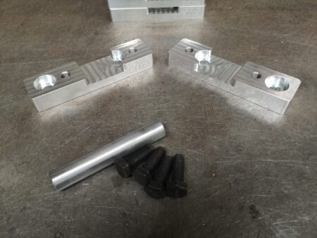 RX8 K swap billet steering rack spacers.
